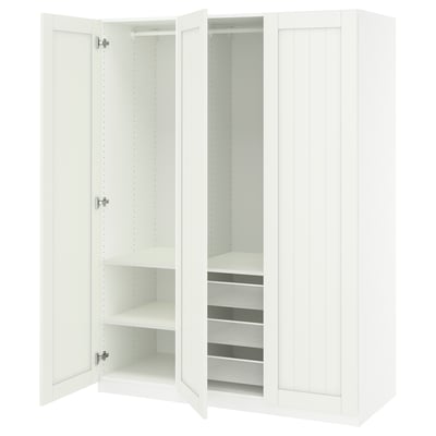 White PAX wardrobe with open doors revealing shelves and a mesh basket.