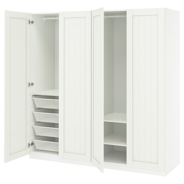 White PAX closet with open sections, shelves, and drawers.