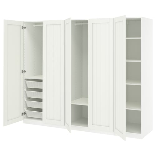 A white PAX wardrobe with shelves and mesh baskets.