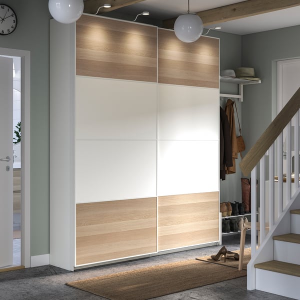 Modern entryway with PAX wardrobe; light wood and white tones, sliding doors, organised accessories.