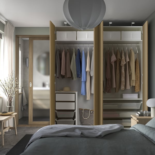 Modern bedroom with open closet, shelves, and soft-close doors.