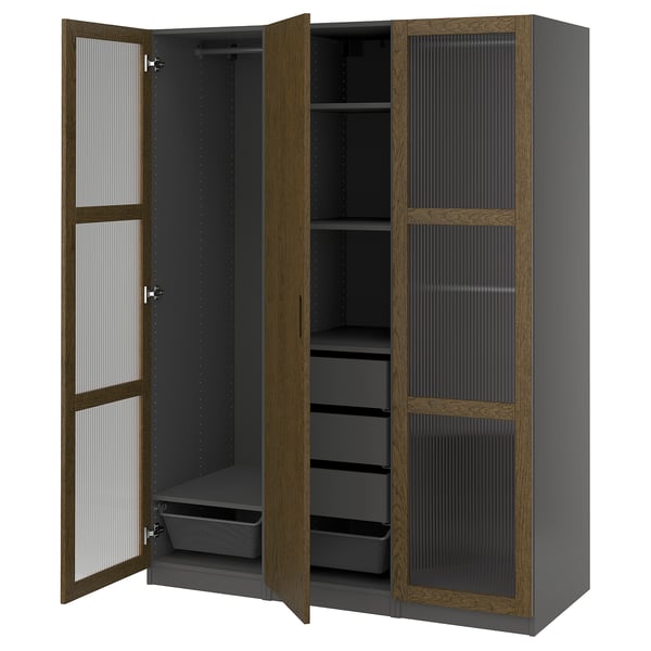 PAX wardrobe in grey and oak. It has glass doors, shelves, and drawers. Modern, functional design.