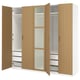 This image a wooden PAX wardrobe with open doors, displaying shelves and drawers inside.