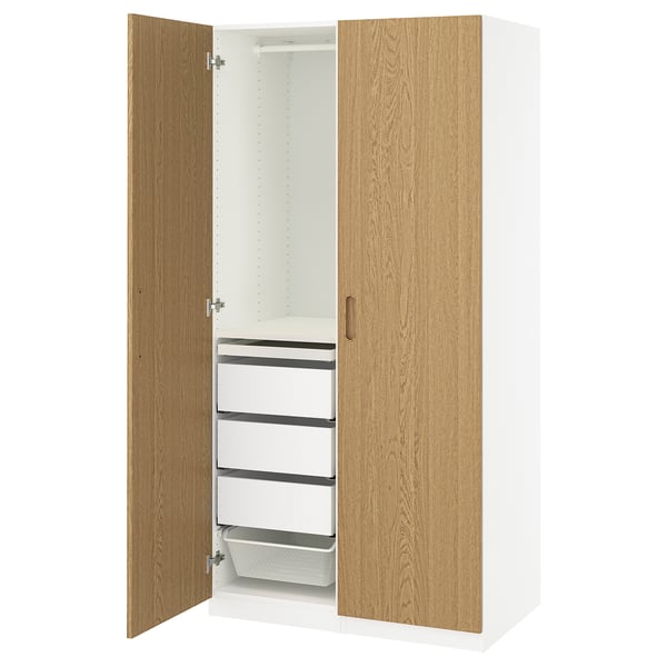 A white PAX wardrobe with oak doors, featuring shelves and drawers inside.
