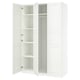 White ikea PAX wardrobe with open doors, showing empty shelves.