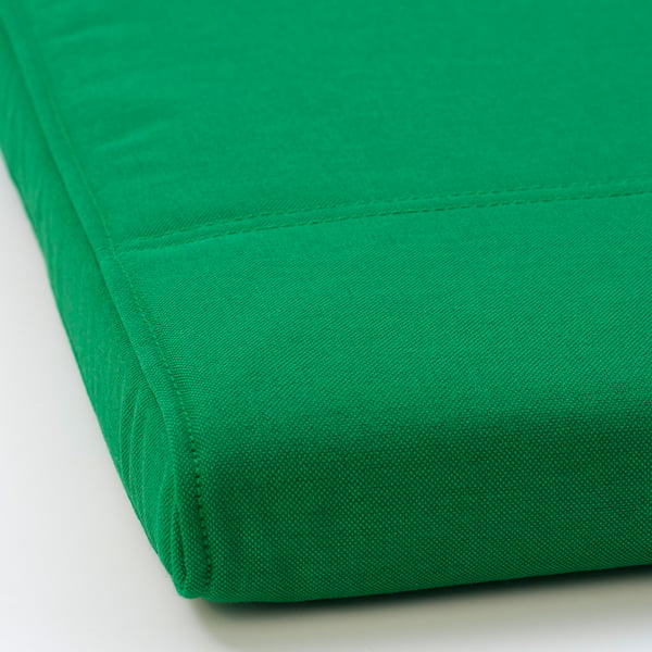 Bright green, upholstered footstool with neat stitching detail, high-quality fabric, and sturdy frame.