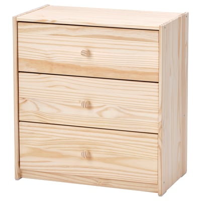 An unpainted wooden RAST chest with three drawers, crafted from solid pine and fibreboard, showcasing a simple, rectangular design.