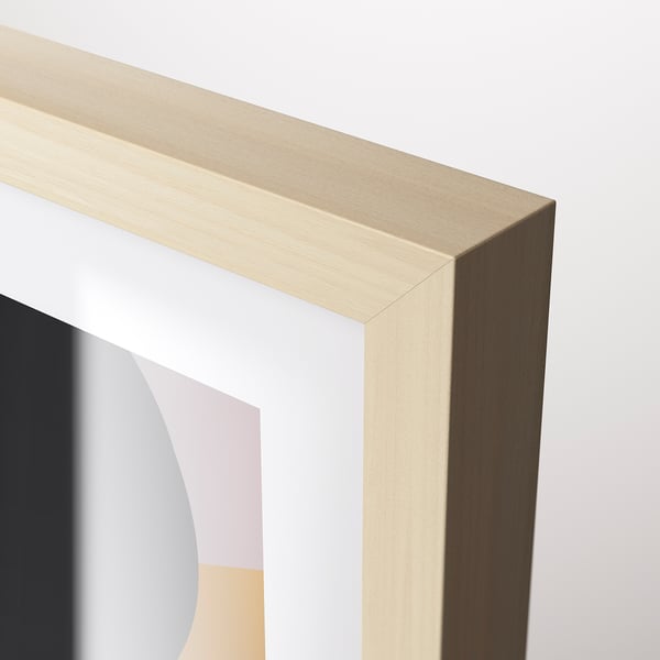 A close-up of a gold-colored wooden frame, showcasing its sleek and polished finish, designed for modern picture display.