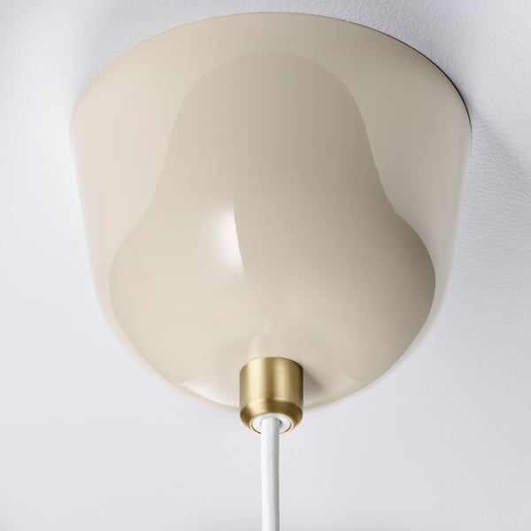 Modern pendant lamp with cream shade and gold accents, white cord.