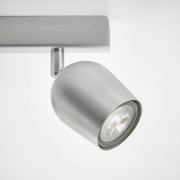 Modern metal ceiling spotlight, sleek silver finish, adjustable bulb for directed light.