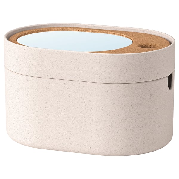 A SAXBORGA storage box, white, with a mirror, cork, and wooden accents. Its oval-shaped with a lid and compartments for organising small items.