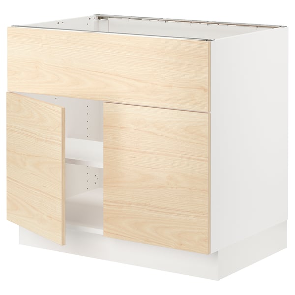 Modern kitchen cabinet in light wood & white. Two doors, adjustable shelves, and a sturdy frame.