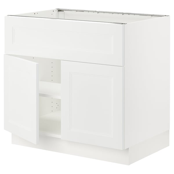 Displays a SEKTION kitchen unit in white with a modern design, featuring a large cabinet and a drawer.
