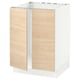 A white and light wood ikea SEKTION base kitchen cabinet with a metal frame.