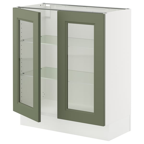 An ikea SEKTION kitchen cabinet with grey-green axstad glass doors. The cabinet is white with two glass doors revealing adjustable shelves inside.
