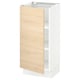 A SEKTION kitchen cabinet with a light wood door and white base. The modern design offers adjustable shelves.