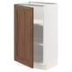 SEKTION kitchen cabinet in white and walnut. One door open, two shelves visible.