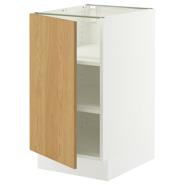 A white SEKTION cabinet with an oak veneer door, left-open. Its rectangular and modern, featuring multiple adjustable shelves.