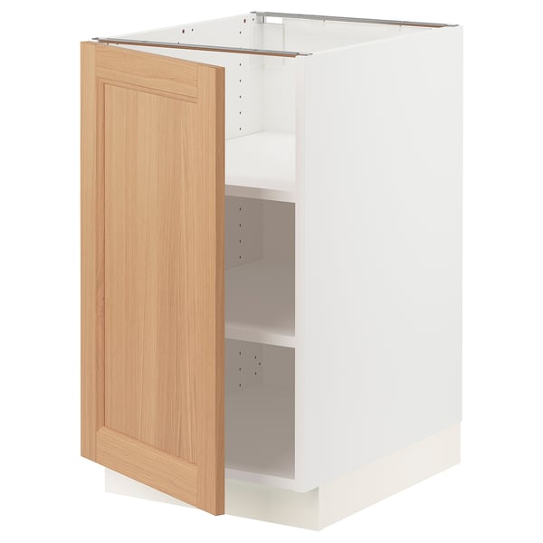 SEKTION kitchen cabinet in white and light wood, open door, adjustable shelves. Modern, minimalist design with sturdy frame.