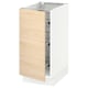 Wooden cabinet door opened, white frame handles visible.