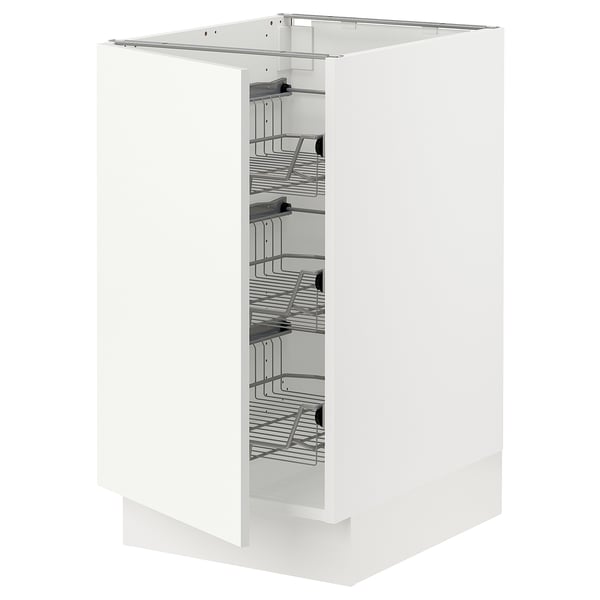 A white SEKTION kitchen cabinet with pull-out wire baskets.