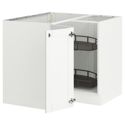 White corner cabinet with pull-out shelves.