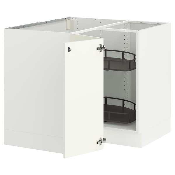 A white SEKTION corner base cabinet with a pull-out carousel storage system.