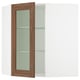 SEKTION kitchen cabinet with walnut foil doors and glass shelves.