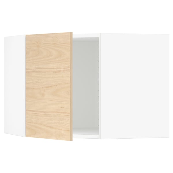 An open white kitchen cabinet with a light wooden door partially ajar.
