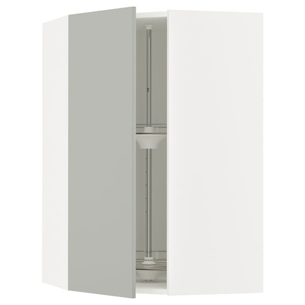 A SEKTION light grey kitchen cabinet with a carousel inside.