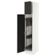 SEKTION white kitchen cabinet with black doors, adjustable shelves, and soft-closing hinges.