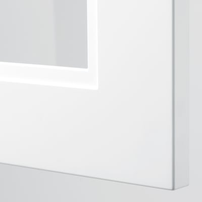 Close-up of sleek, white cabinet with modern, minimalist design. High-quality materials, adjustable shelves, durable construction.