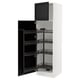 White kitchen cabinet with black pull-out shelves and door open.