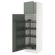 White kitchen cabinet with three green pull-out shelves.