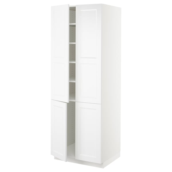 A white SEKTION tall kitchen cabinet with two open doors revealing adjustable shelves. The cabinet is sleek and rectangular with a modern design.
