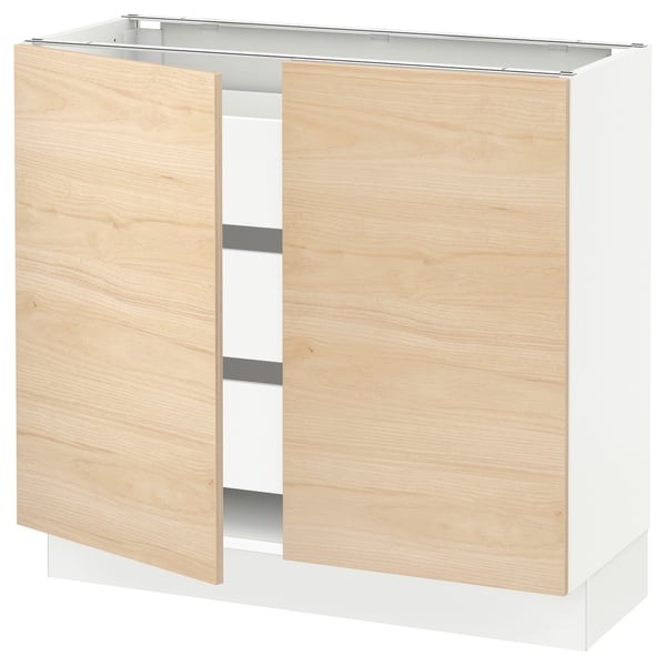 An ikea SEKTION kitchen cabinet with light ash wood askersund doors, featuring a sleek and modern design.