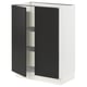 A SEKTION kitchen cabinet with black doors open, revealing inner shelves. Its sleek, modern, and made of particle board and steel.
