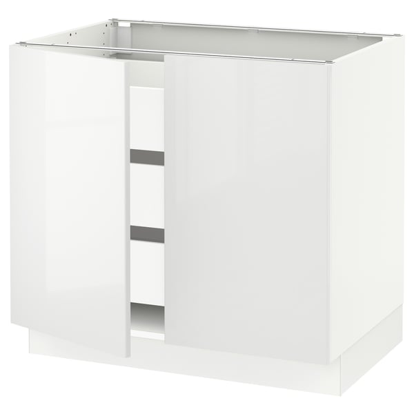 White kitchen cabinet, modern design, glossy finish, rectangular shape, with open compartments and metal support.