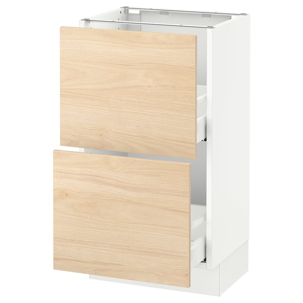 A SEKTION kitchen cabinet in white with light ash wooden drawers, featuring a sleek design and sturdy construction.