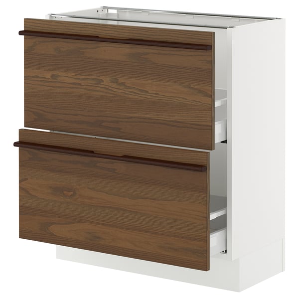 A white SEKTION kitchen cabinet with dark brown wooden drawers and metal handles. It has two full-extension drawers with a sleek, modern design.