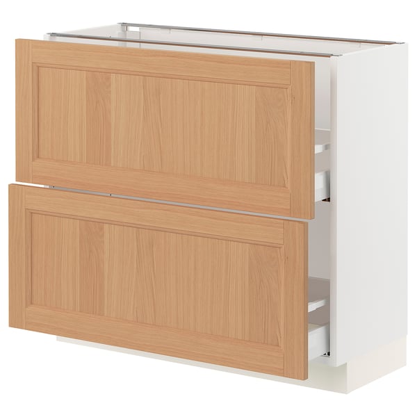 Ikea SEKTION kitchen cabinet in light wood. Has 2 wooden drawers and silver handles. Rectangular shape, simple design.