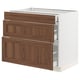 An ikea SEKTION kitchen unit with three walnut-colored drawers. Its white with wooden fronts and smooth-running drawers.