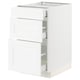 White SEKTION kitchen cabinet with wood grain texture and multiple drawers.