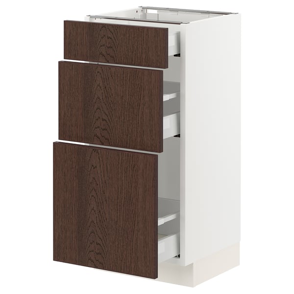 SEKTION kitchen cabinet in white with dark brown wood drawers and metal runners.