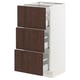 SEKTION kitchen cabinet with dark brown sinarp wood drawers and white frame.