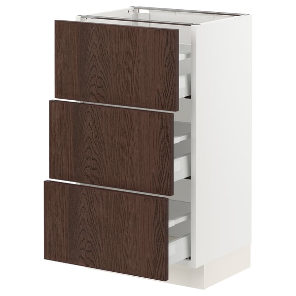 A modern kitchen cabinet with three dark brown wooden drawers, a white base, and metallic drawer handles.