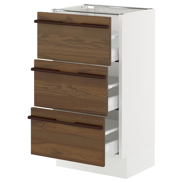 An ikea SEKTION kitchen cabinet with dark brown stained ash veneer drawers and solid wood handles.