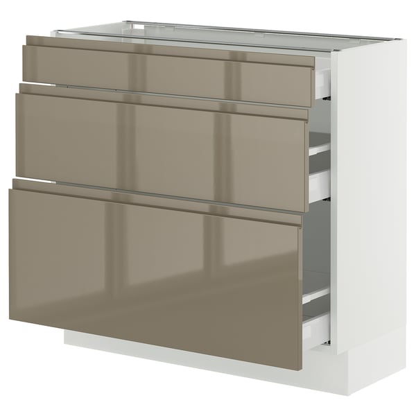 Modern kitchen cabinet, SEKTION series, sleek light brown, metal handles, integrated drawers, high gloss finish.