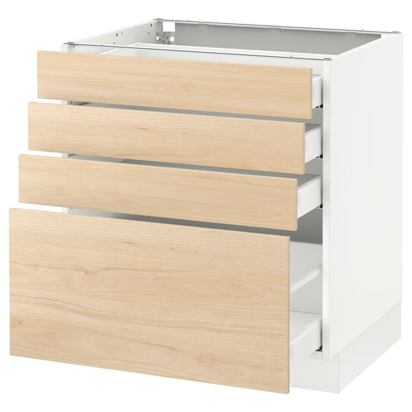 Modern white kitchen cabinet with three light ash wood drawers.