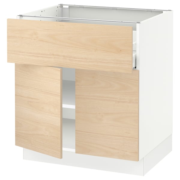 Modern light wood kitchen cabinet with drawer and shelves.